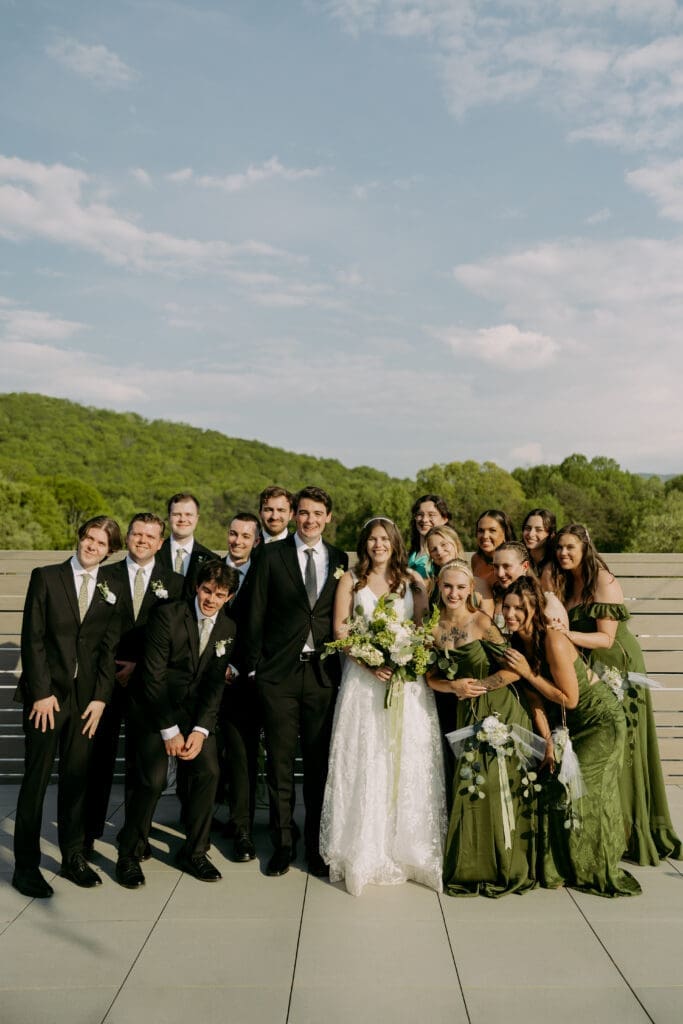 highland brewing wedding party portraits at rooftop ceremony space.