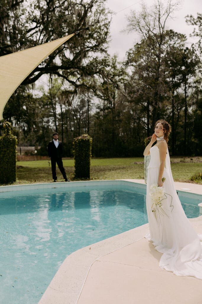 poolside bride and groom portraits at charleston sc wedding venue 