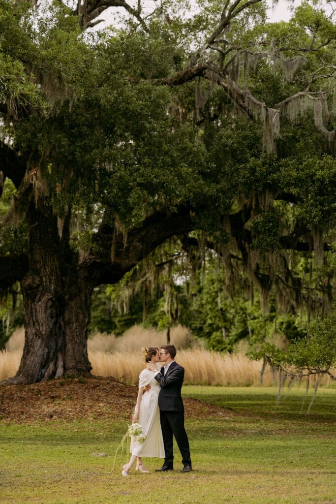 Bride and groom portraits at Pine Creek Place surrounded by Lowcountry oak trees
