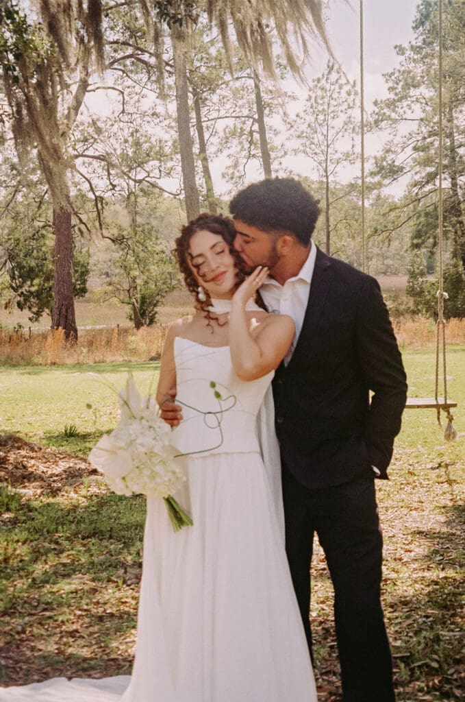 bride and groom sharing a kiss at pine creek place