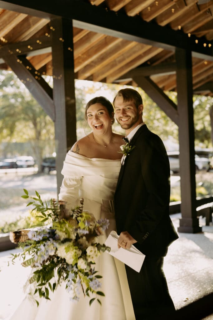 bride and groom at pepper pavilion sharing excitement after their ceremony