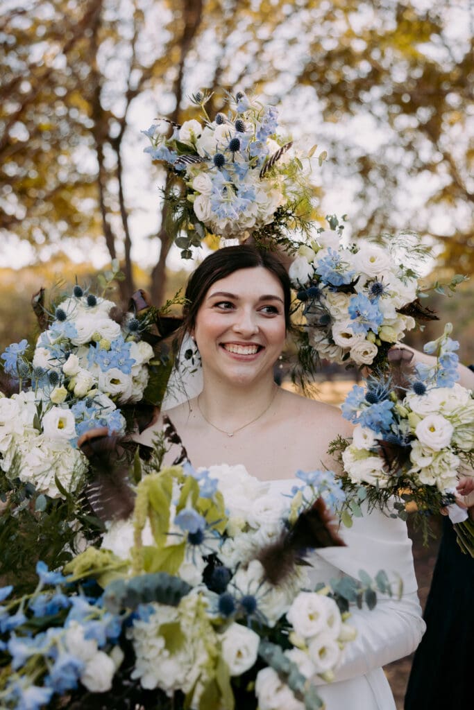 pepper pavilion bride smiling with flowers around her
