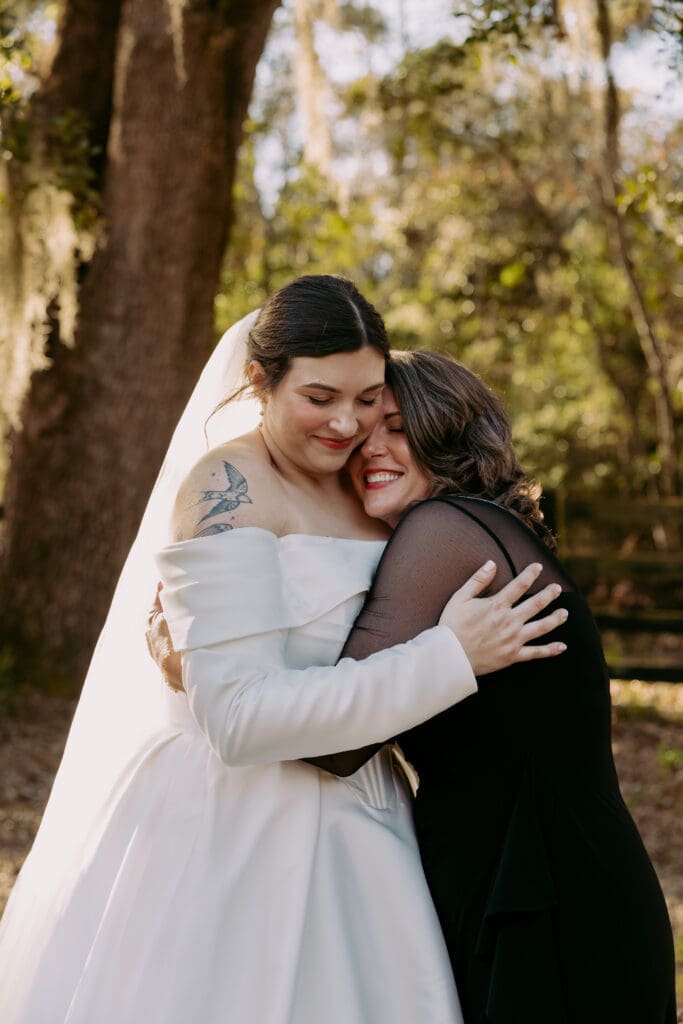 bride and mom hugging