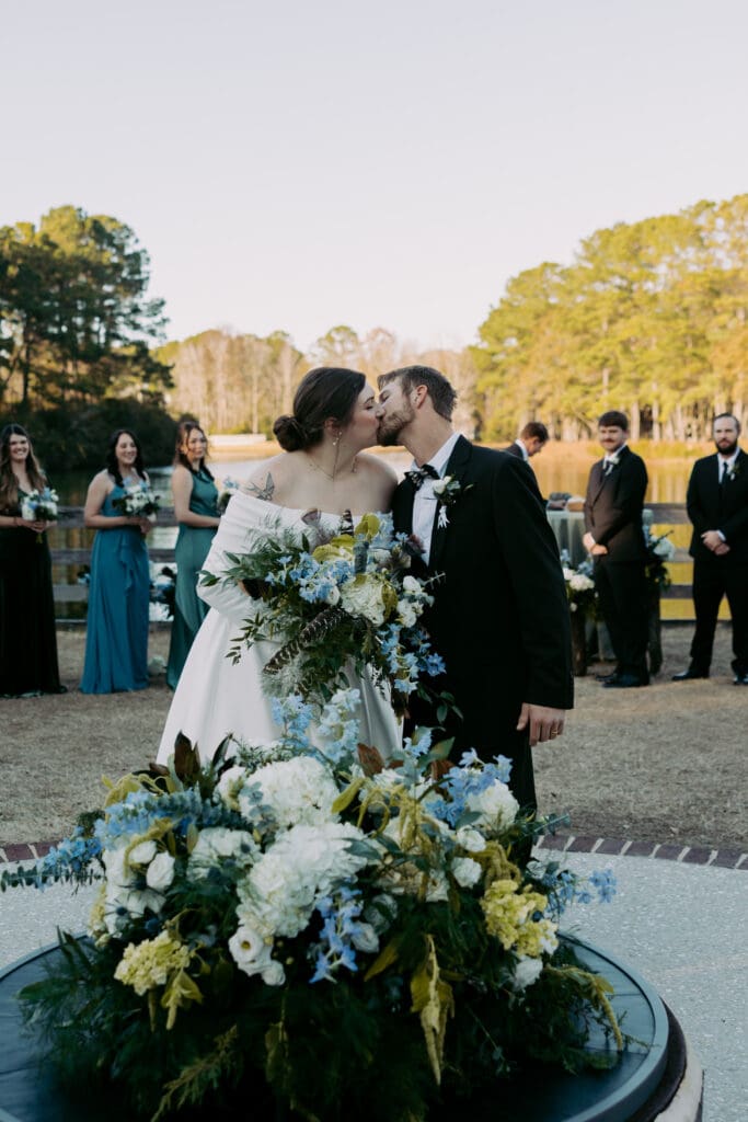 bride and groom first kiss