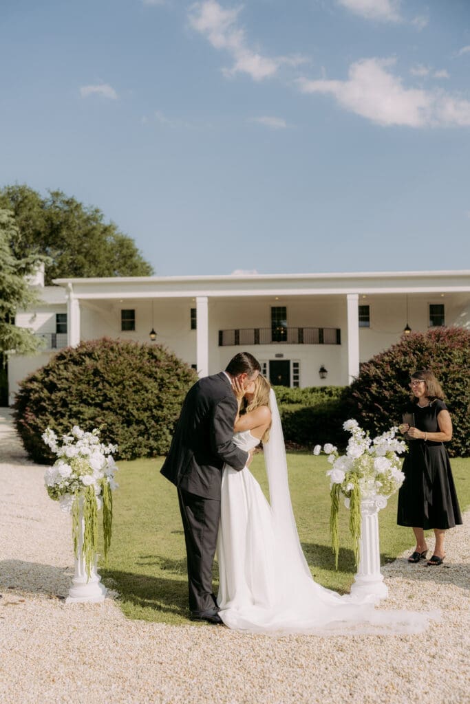 bride and groom kissing at twin fields estate venue