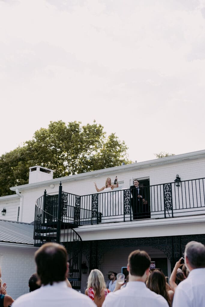 bride and groom excited at cocktail hour, being announced as husband and wife